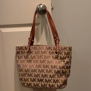Michael Kors canvas tote/shoulder bag. Straps are 11” shoulder to purse.